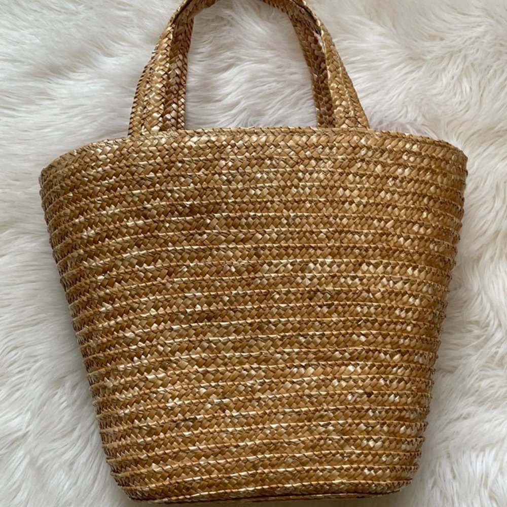 Wicker woven basket with pop of pink fabric liner